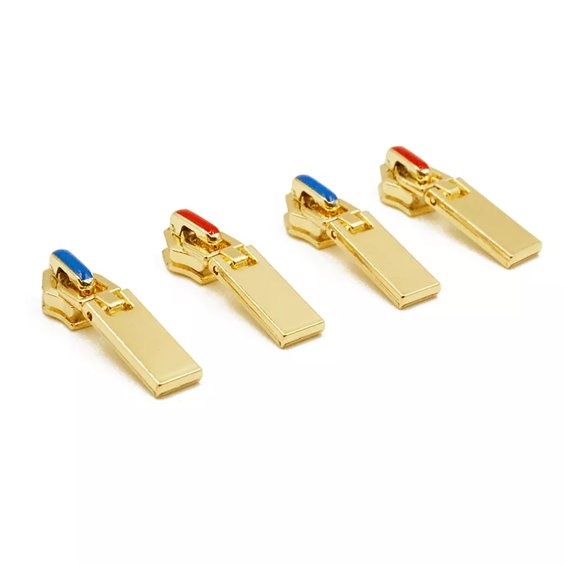 Color-accented zipper pullers in different finishes and colors